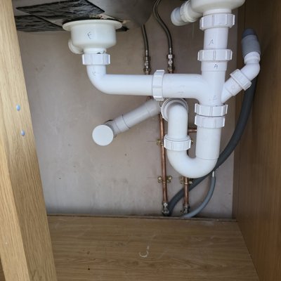 Repaired under sink waste pipework