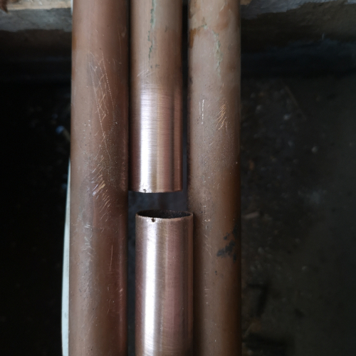 Heating pipe leak being repaired
